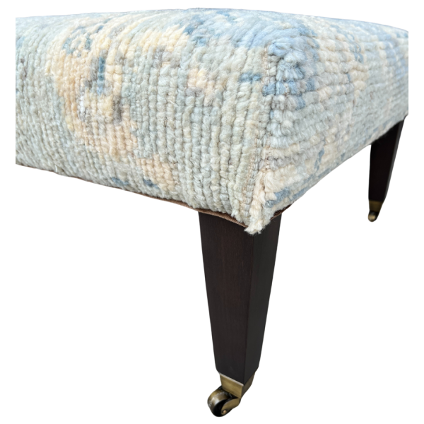 rug-covered ottoman